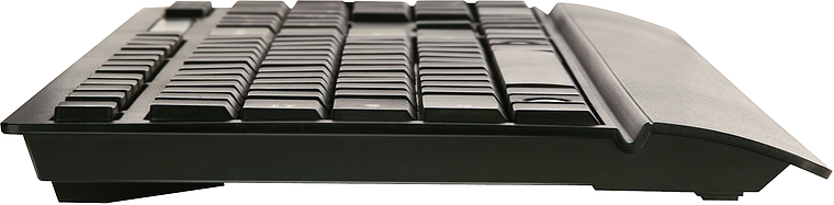 Schwarze Computertastatur seitlich fotografiert, mit ergonomischer Handballenauflage