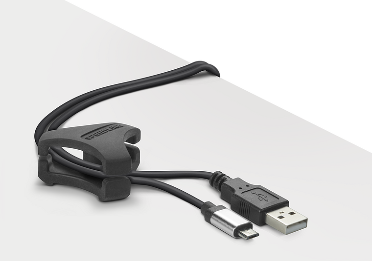 Schwarzes USB-Ladekabel mit Micro-USB-Anschluss und praktischem Kabelhalter auf einem weißen Schreibtisch