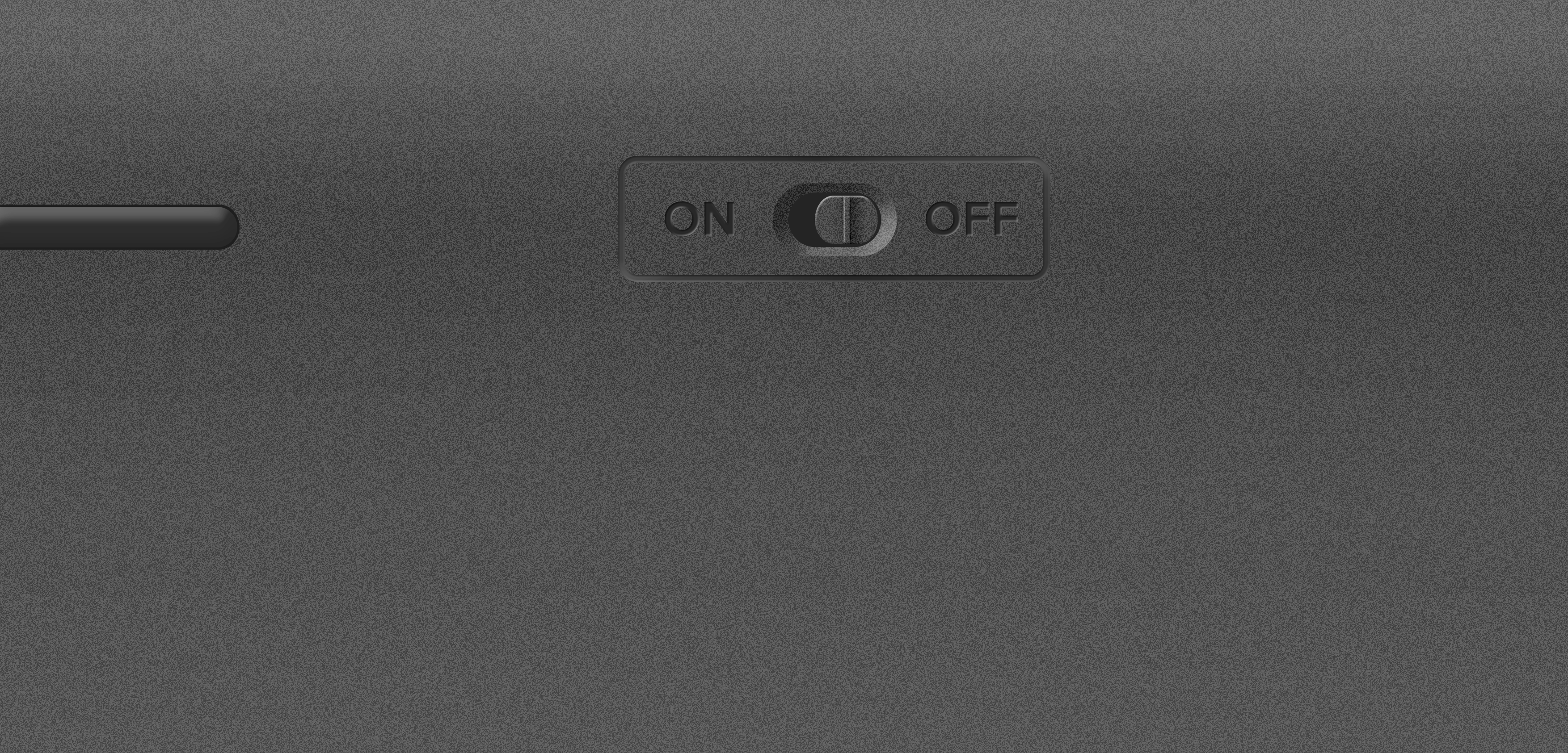 Schwarzer Kippschalter mit ON/OFF-Beschriftung auf einer dunklen Geräteoberfläche